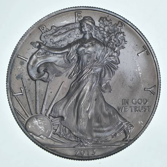 2013 American Silver Eagle planchet lamination error showing surface blistering or delamination of the silver blank